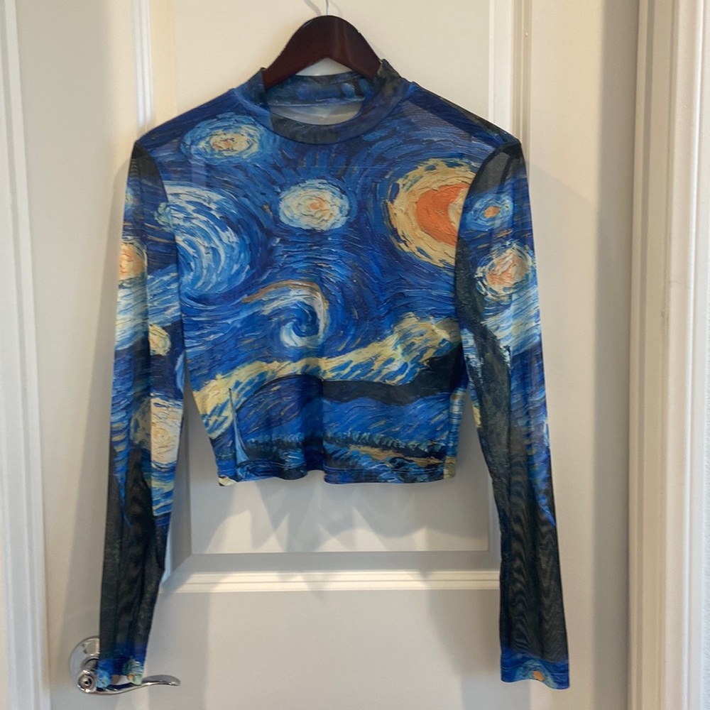 Shein shear long sleeved, shear top with various colors.